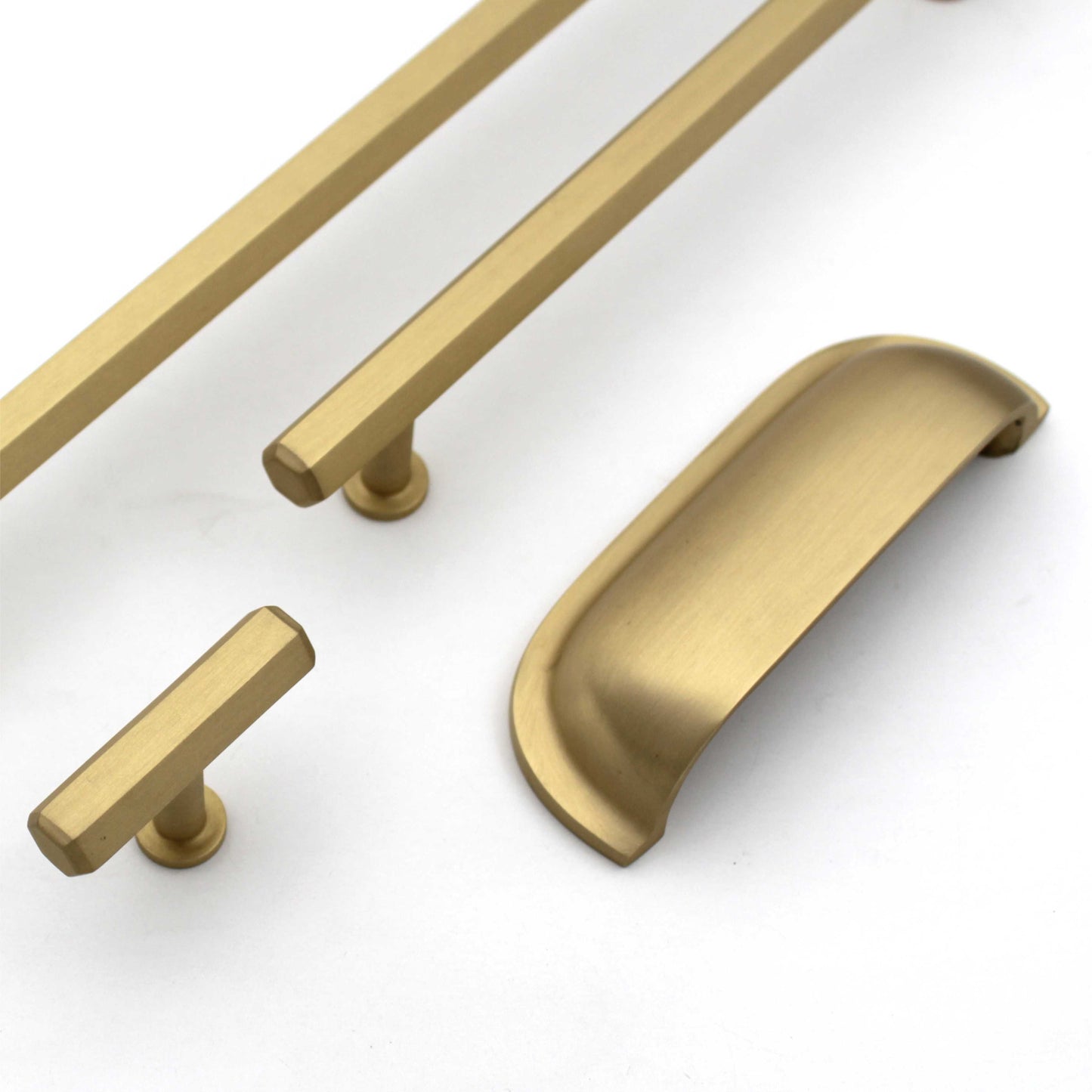 A set of satin gold brass cabinet bar pull handles in various sizes, including both bar pull and knob styles, displayed against a white background.