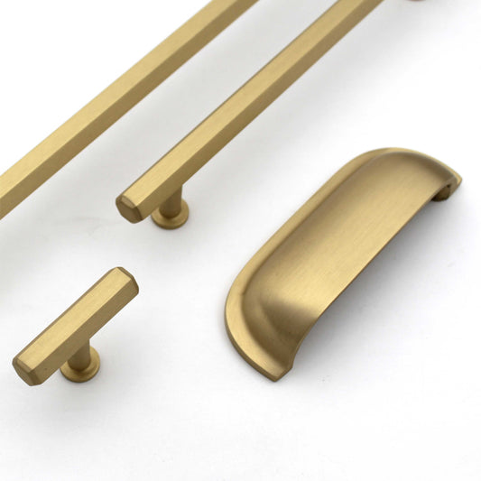 A set of satin gold brass cabinet bar pull handles in various sizes, including both bar pull and knob styles, displayed against a white background.
