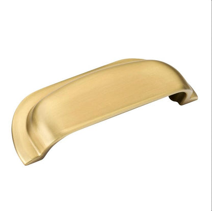 Gold cabinet handle on a white background
